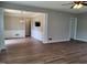 Living room area with hardwood flooring, and paneled walls at 4903 Bridgewood Dr, Durham, NC 27713
