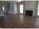 Living room featuring a fireplace and stairwell at 4903 Bridgewood Dr, Durham, NC 27713
