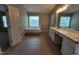 Large main bathroom with a soaking tub and a double sink vanity at 4903 Bridgewood Dr, Durham, NC 27713