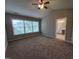 Bright main bedroom with large windows and ensuite bathroom access at 4903 Bridgewood Dr, Durham, NC 27713