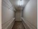Bright walk-in closet with wire shelving, providing ample space for storage needs at 4903 Bridgewood Dr, Durham, NC 27713