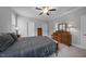 A serene bedroom with a queen-size bed, neutral walls, carpet, and dark wood furniture with mirrors at 50 Harriet Gentry Ln, Timberlake, NC 27583