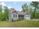 Exterior of the home features a small front porch and attached one car garage at 50 Harriet Gentry Ln, Timberlake, NC 27583
