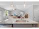The kitchen island with granite counters sits adjacent to the living room and features a stainless steel sink at 50 Harriet Gentry Ln, Timberlake, NC 27583