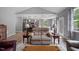 Open-concept living space seamlessly connects to the kitchen, with abundant natural light and stylish hardwood floors at 50 Harriet Gentry Ln, Timberlake, NC 27583