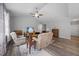 Open-concept living area with vaulted ceiling, fan, hardwood floors, and comfortable seating at 50 Harriet Gentry Ln, Timberlake, NC 27583