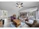 Spacious living room with vaulted ceilings, ceiling fan, hardwood floors, and lots of seating at 50 Harriet Gentry Ln, Timberlake, NC 27583