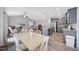 This shot shows an open floor plan featuring a dining room, living room, and kitchen with granite countertops at 50 Harriet Gentry Ln, Timberlake, NC 27583