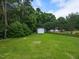 Lush backyard with mature trees provides privacy for the shed at 5009 Beckwyck Dr, Fuquay Varina, NC 27526