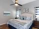 Inviting bedroom with a vaulted ceiling, a decorative ceiling fan, and a plush patterned bedspread at 5009 Beckwyck Dr, Fuquay Varina, NC 27526