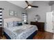 Serene bedroom with vaulted ceilings, wooden floors and a coordinated blue and white decor at 5009 Beckwyck Dr, Fuquay Varina, NC 27526