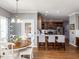 Charming breakfast nook features a round wooden table and views of the kitchen island with seating at 5009 Beckwyck Dr, Fuquay Varina, NC 27526
