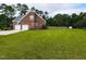 Beautiful brick home with a large front yard, two-car garage, and well-maintained lawn at 5009 Beckwyck Dr, Fuquay Varina, NC 27526