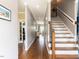 Inviting foyer with hardwood floors and staircase at 5009 Beckwyck Dr, Fuquay Varina, NC 27526