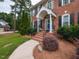 Charming front entrance with brick steps and wrought iron railings at 5009 Beckwyck Dr, Fuquay Varina, NC 27526