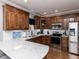 Well-equipped kitchen with stainless steel appliances, wood cabinetry, and a modern countertop at 5009 Beckwyck Dr, Fuquay Varina, NC 27526