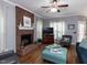 Charming living room with brick fireplace and hardwood floors at 5009 Beckwyck Dr, Fuquay Varina, NC 27526