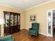 Comfortable living room with an elegant display cabinet at 5009 Beckwyck Dr, Fuquay Varina, NC 27526