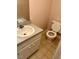 This bathroom has a toilet, sink, and vintage-style tile at 509 W Rose St, Sanford, NC 27330