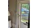 Back door view looking to the yard with parking at 509 W Rose St, Sanford, NC 27330