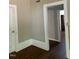 Entryway showing the transition from a hardwood floor to a room with carpet at 509 W Rose St, Sanford, NC 27330