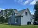 Back view of a charming two-story house and green lawn at 509 W Rose St, Sanford, NC 27330