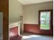 Comfortable living room with a fireplace, and nice window at 509 W Rose St, Sanford, NC 27330