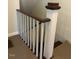 This is a staircase with a wooden railing and carpet at 509 W Rose St, Sanford, NC 27330