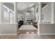 Open living room with high ceilings, lots of light, fireplace, and an adjacent dining area at 5516 Colonial Oaks Dr, Apex, NC 27539