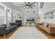Inviting living room featuring high ceilings, lots of windows, fireplace and comfortable seating at 5516 Colonial Oaks Dr, Apex, NC 27539