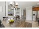 Open floor plan featuring a dining area leading to a living room with a fireplace and high ceilings at 5516 Colonial Oaks Dr, Apex, NC 27539