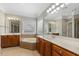 Luxurious main bathroom with dual vanities, soaking tub, and tile flooring at 5516 Colonial Oaks Dr, Apex, NC 27539