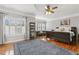 Spacious main bedroom boasts hardwood floors, ceiling fan, and ample natural light at 5516 Colonial Oaks Dr, Apex, NC 27539