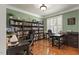 Dedicated office space offers hardwood floors, built-in bookshelves, and ample desk space at 5516 Colonial Oaks Dr, Apex, NC 27539