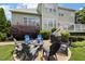 Outdoor patio area features comfortable seating and a grill, ideal for relaxing and entertaining at 5516 Colonial Oaks Dr, Apex, NC 27539