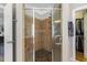 Tiled shower with a glass enclosure and convenient built-in niche at 5516 Colonial Oaks Dr, Apex, NC 27539