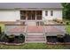Backyard features a large wooden deck with steps leading to a screened-in porch and manicured landscape at 589 John Mitchell Rd, Youngsville, NC 27596