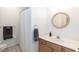 Bathroom featuring a vanity with sink and a shower/tub with a curtain at 589 John Mitchell Rd, Youngsville, NC 27596