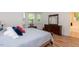 Bedroom featuring hardwood floors, multiple windows and attached bathroom at 589 John Mitchell Rd, Youngsville, NC 27596