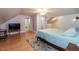 Spacious bedroom featuring hardwood floors, unique ceiling lines and ensuite bathroom at 589 John Mitchell Rd, Youngsville, NC 27596