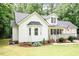 Attractive exterior view showcasing the home's architecture and landscaping with surrounding greenery and well-manicured lawn at 589 John Mitchell Rd, Youngsville, NC 27596
