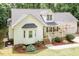 Charming home with well-kept lawn, covered porch, and landscaping, offering a cozy curb appeal at 589 John Mitchell Rd, Youngsville, NC 27596