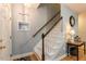 Bright foyer with wooden staircase, and hardwood flooring at 589 John Mitchell Rd, Youngsville, NC 27596