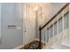 Bright foyer with a wooden staircase and stylish accents creating a welcoming entrance at 589 John Mitchell Rd, Youngsville, NC 27596