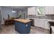 Open kitchen featuring a butcher block island, stainless steel appliances, and adjoining dining area at 589 John Mitchell Rd, Youngsville, NC 27596
