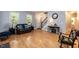 Cozy living room features hardwood floors, staircase, and natural lighting at 589 John Mitchell Rd, Youngsville, NC 27596