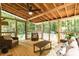 Relaxing screened porch with comfortable seating, perfect for enjoying the outdoors in comfort at 589 John Mitchell Rd, Youngsville, NC 27596