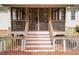 Stairs lead to an elevated screened porch at 589 John Mitchell Rd, Youngsville, NC 27596