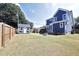 Spacious fenced backyard with a patio, a storage shed and a grassy area at 595 E Cabarrus St, Raleigh, NC 27601