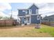 Backyard featuring a patio area, fire pit, fenced yard and a two-story home at 595 E Cabarrus St, Raleigh, NC 27601